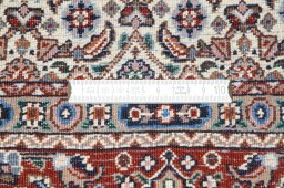 Backside of handmade New Moud rug showing knot structure and weave density