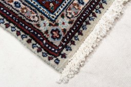 Backside of handmade New Moud rug showing knot structure and weave density