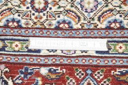 Backside of handmade New Moud rug showing knot structure and weave density