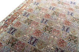 Backside of handmade 2000s Moud rug showing knot structure and weave density
