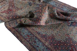 Surface texture of 2000s Moud rug with natural Wool and intricate pattern
