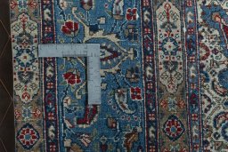 Backside of handmade 2000s Moud rug showing knot structure and weave density
