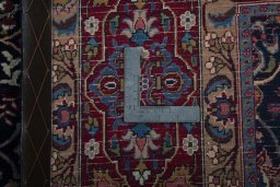 Surface texture of 1970s Moud rug with natural Wool and intricate pattern
