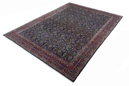 Corner detail of 1970s Moud rug showing border pattern and Wool pile