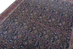 Backside of handmade 1970s Moud rug showing knot structure and weave density