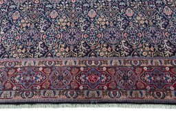 Close-up detail of 1970s Moud rug from Iran / Persia showing Wool weave