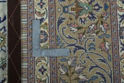 Backside of handmade 2000s Moud rug showing knot structure and weave density