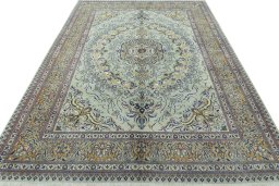 Surface texture of 2000s Moud rug with natural Wool and intricate pattern