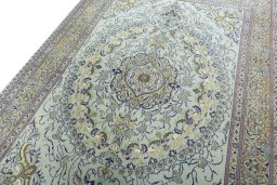 Backside of handmade 2000s Moud rug showing knot structure and weave density