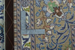 Backside of handmade 2000s Moud rug showing knot structure and weave density