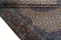 Close-up detail of 2000s Moud rug from Iran / Persia showing Wool weave