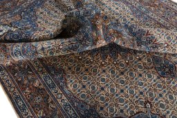 Surface texture of 2000s Moud rug with natural Wool and intricate pattern