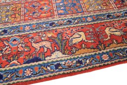 Backside of handmade 2000s Moud rug showing knot structure and weave density