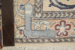 Corner detail of New Nain rug showing border pattern and Wool pile