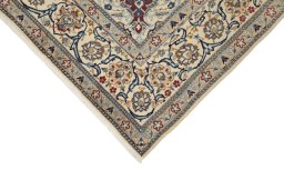 Backside of handmade New Nain rug showing knot structure and weave density