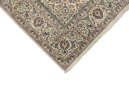 Backside of handmade New Nain rug showing knot structure and weave density