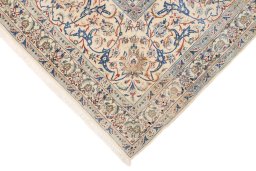Backside of handmade New Nain rug showing knot structure and weave density