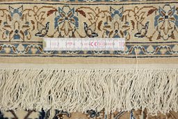 Full view of 1960s Nain rug from Iran / Persia, 275 × 170 cm in Brown tones