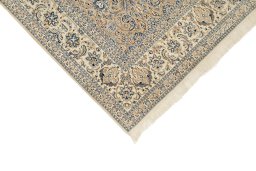 Backside of handmade 1960s Nain rug showing knot structure and weave density