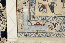 Close-up detail of 1980s Nain rug from Iran / Persia showing Wool weave