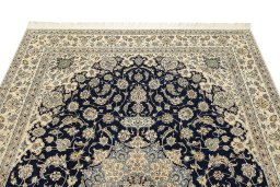 Surface texture of 1980s Nain rug with natural Wool and intricate pattern