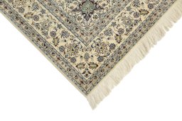 Backside of handmade 1980s Nain rug showing knot structure and weave density