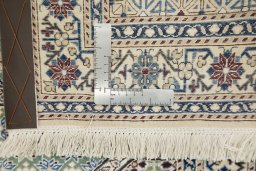 Corner detail of New Nain rug showing border pattern and Wool pile