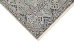 Backside of handmade New Nain rug showing knot structure and weave density