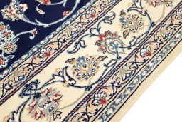 Corner detail of 1990s Nain rug showing border pattern and Wool pile