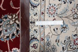 Backside of handmade New Nain rug showing knot structure and weave density