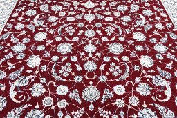 Backside of handmade New Nain rug showing knot structure and weave density