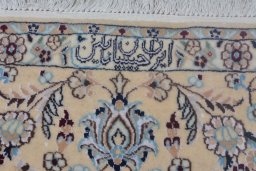 Backside of handmade New Nain rug showing knot structure and weave density