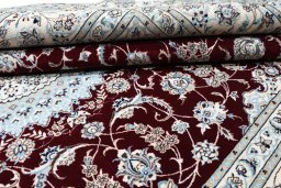 Backside of handmade New Nain rug showing knot structure and weave density