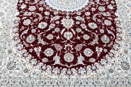 Backside of handmade New Nain rug showing knot structure and weave density