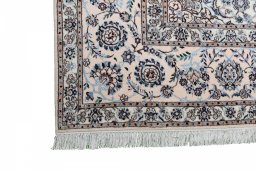 Corner detail of New Nain rug showing border pattern and Wool pile