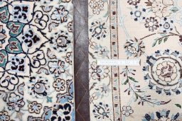 Backside of handmade New Nain rug showing knot structure and weave density