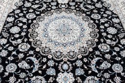 Backside of handmade New Nain rug showing knot structure and weave density