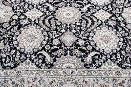 Backside of handmade New Nain rug showing knot structure and weave density