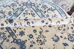 Corner detail of 2000s Nain rug showing border pattern and Wool pile