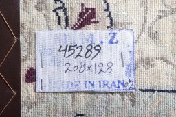 Backside of handmade 2000s Nain rug showing knot structure and weave density