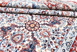 Corner detail of 1930s Nain rug showing border pattern and Wool pile