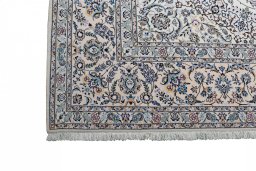 Corner detail of New Nain rug showing border pattern and Wool pile
