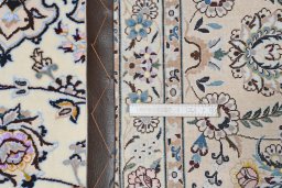 Backside of handmade New Nain rug showing knot structure and weave density
