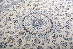 Backside of handmade New Nain rug showing knot structure and weave density