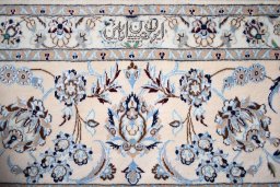 Corner detail of New Nain rug showing border pattern and Cork pile