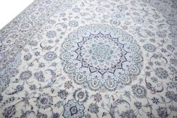 Backside of handmade New Nain rug showing knot structure and weave density