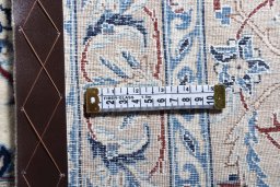 Backside of handmade 1970s Nain rug showing knot structure and weave density