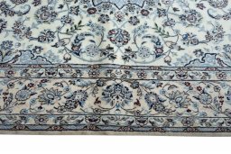 Corner detail of New Nain rug showing border pattern and Cork pile