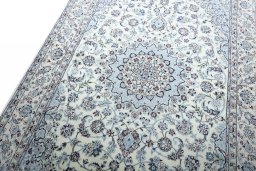 Backside of handmade New Nain rug showing knot structure and weave density
