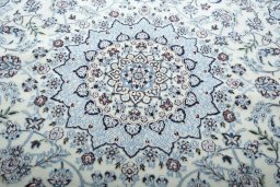 Central medallion detail of New Nain rug from Iran / Persia